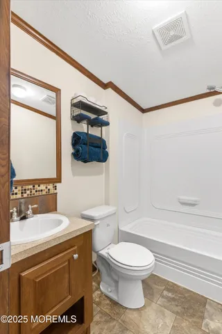 a bathroom with a toilet a sink and a bathtub