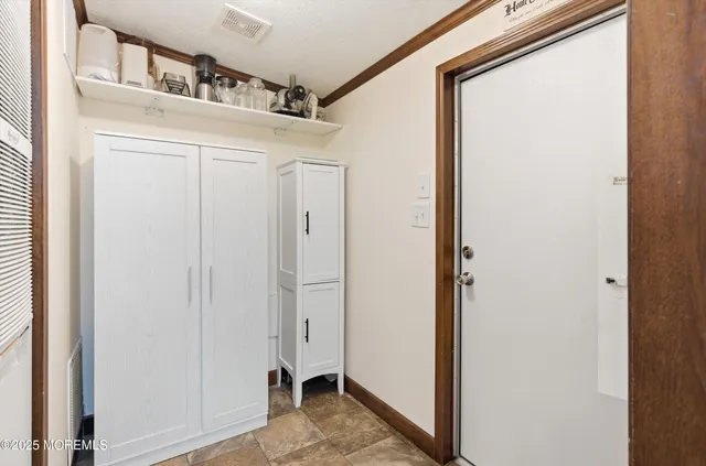 a view of a hallway with closet
