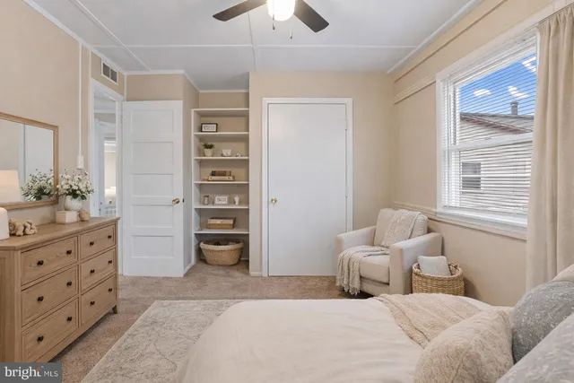 a bedroom with a bed and a dresser