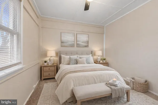 a bedroom with a bed and window