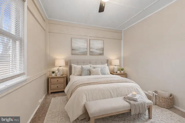 a bedroom with a bed and window