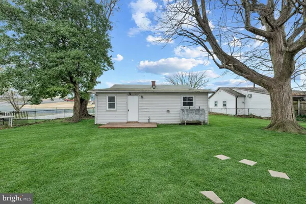 a view of a house with a back yard
