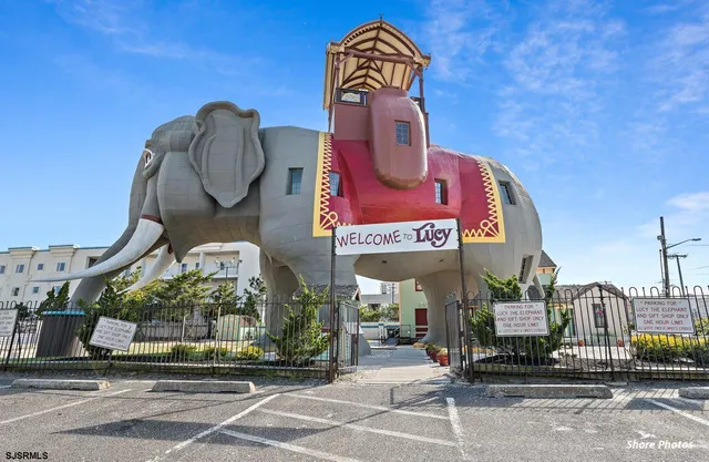 a front view of a building with parking