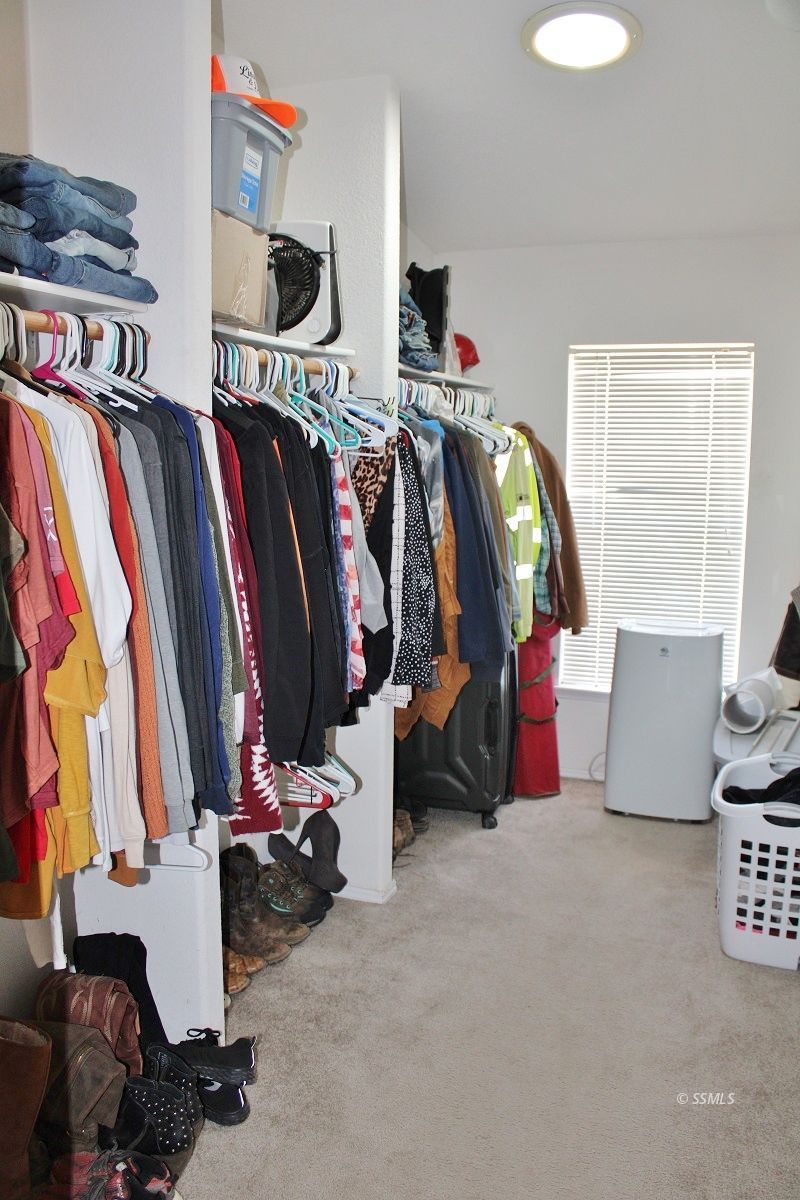 10158 Hillview Acres Road Weldon, CA 93283 - Photo 27 of 45 a view of walk in closet with clothes and shoes