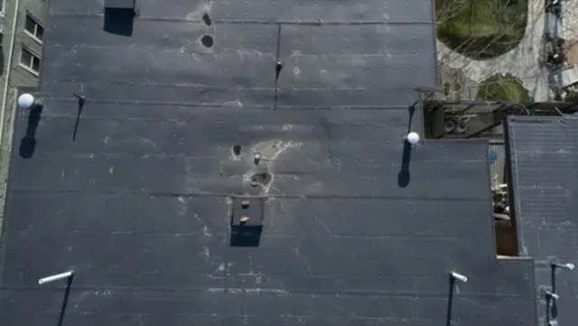 a bathroom with a sink and cabinets
