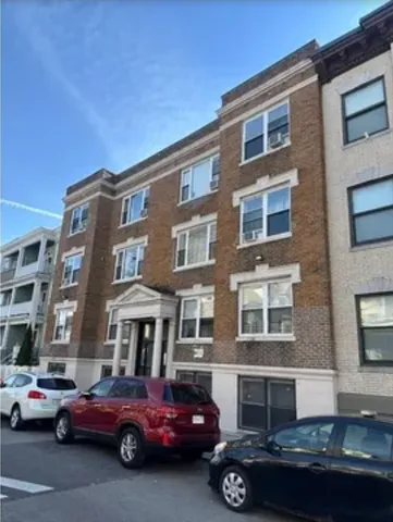 a car parked in front of a building