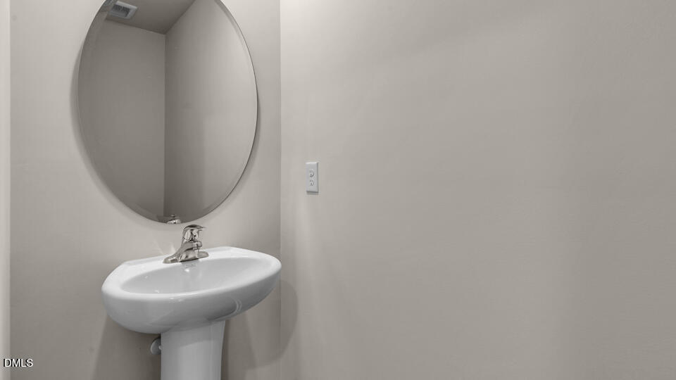 552 Stream Walk Crossing Wendell, NC 27591 - Photo 15 of 42 a bathroom with a sink and a mirror