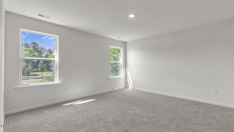 552 Stream Walk Crossing Wendell, NC 27591 - Photo 18 of 42 an empty room with windows
