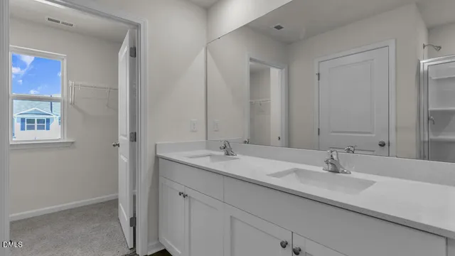 a view of a small space with wooden floor and a window