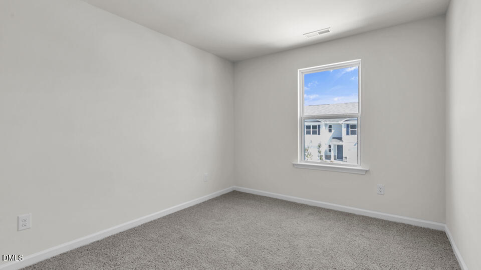 552 Stream Walk Crossing Wendell, NC 27591 - Photo 26 of 42 an empty room with windows