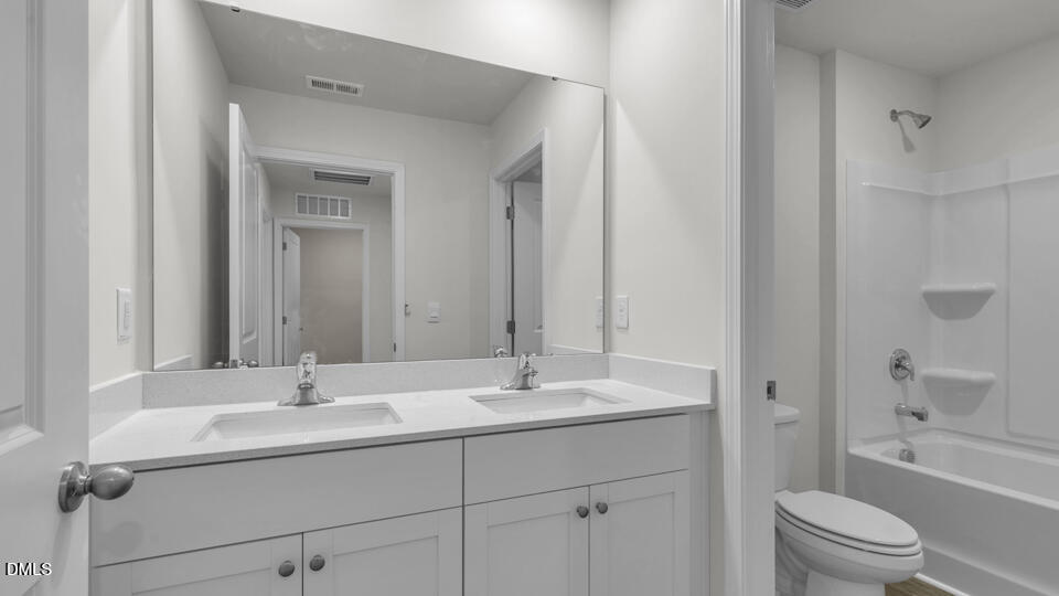 552 Stream Walk Crossing Wendell, NC 27591 - Photo 28 of 42 a bathroom with a sink toilet and shower