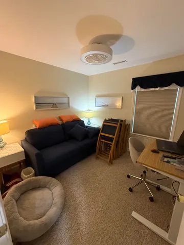 a bedroom with a bed and chandelier