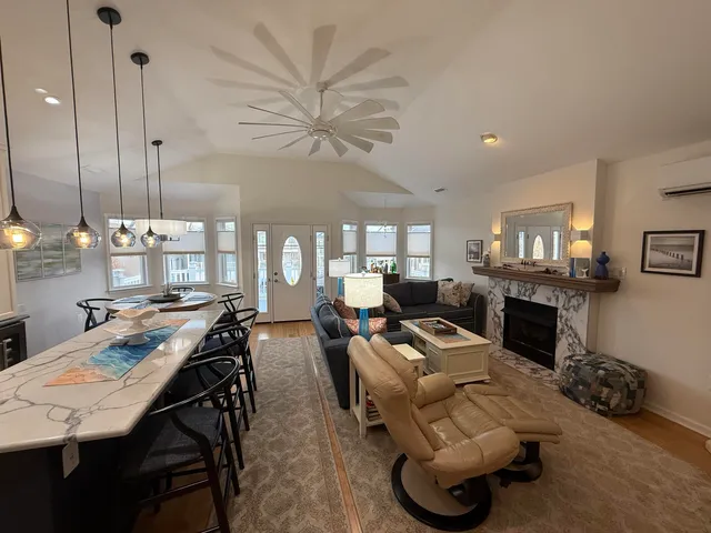 a large kitchen with a table and chairs