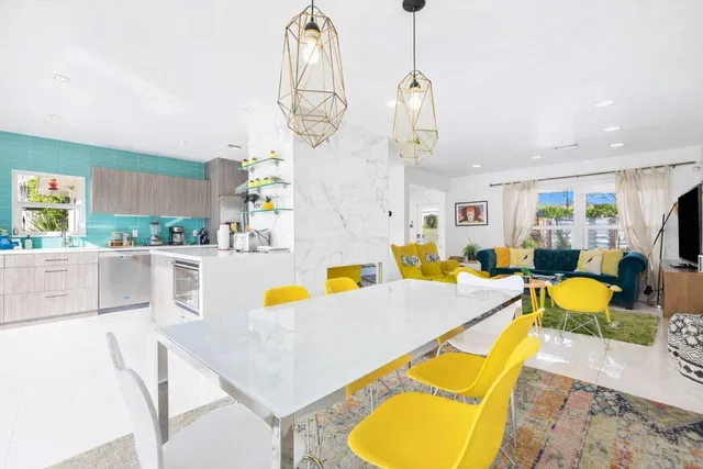 a very nice looking dining room with a table and chairs