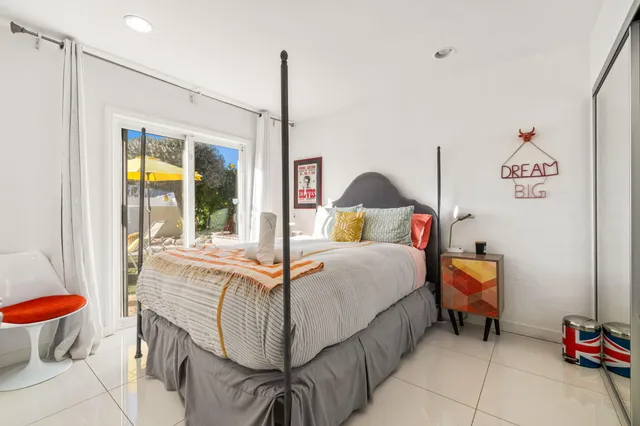 a bathroom with a shower and a sink