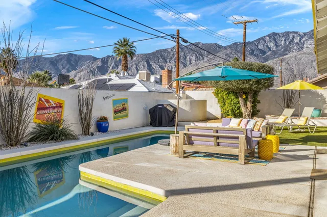 a view of a swimming pool with a patio