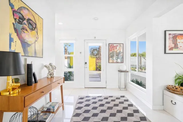 a kitchen with a sink a stove and a refrigerator