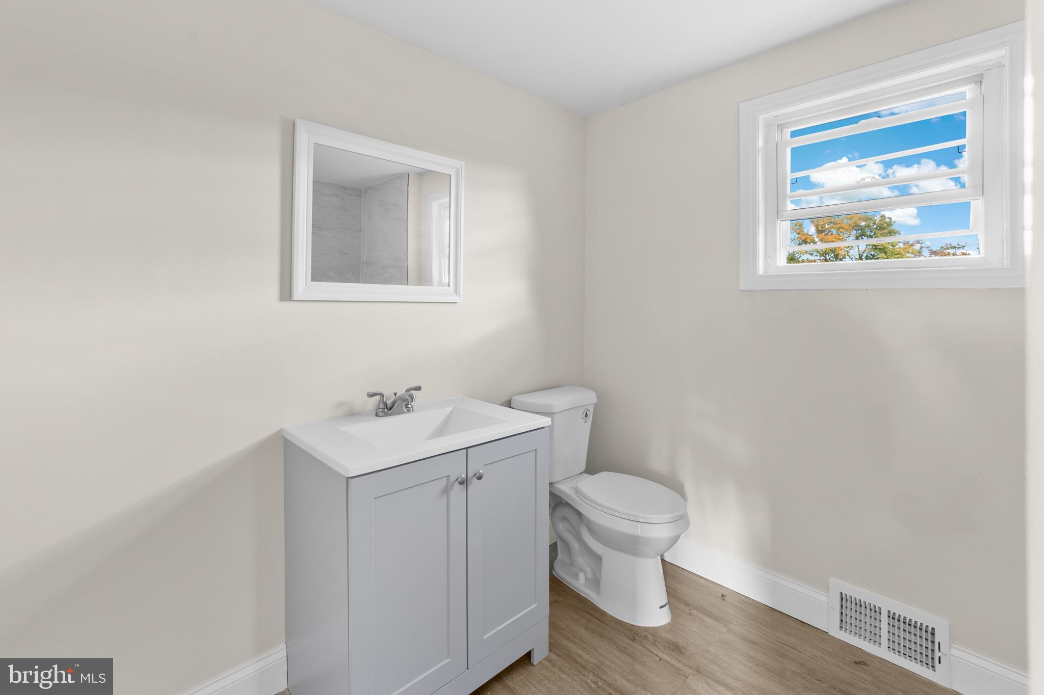280 Qtn Marlboro Road Salem, NJ 08079 - Photo 17 of 32 a bathroom with a toilet a sink and mirror