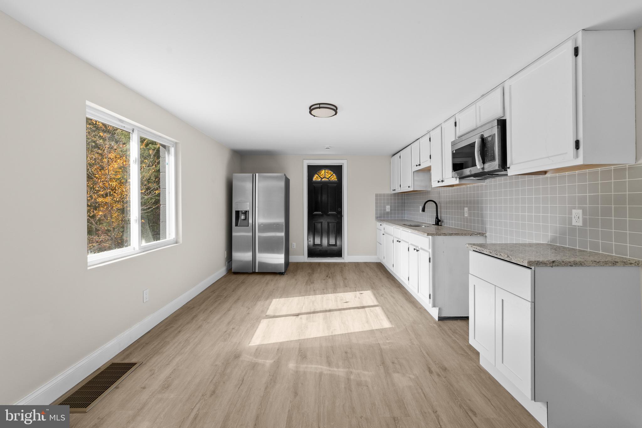 280 Qtn Marlboro Road Salem, NJ 08079 - Photo 17 of 37 a view of a kitchen with microwave and windows