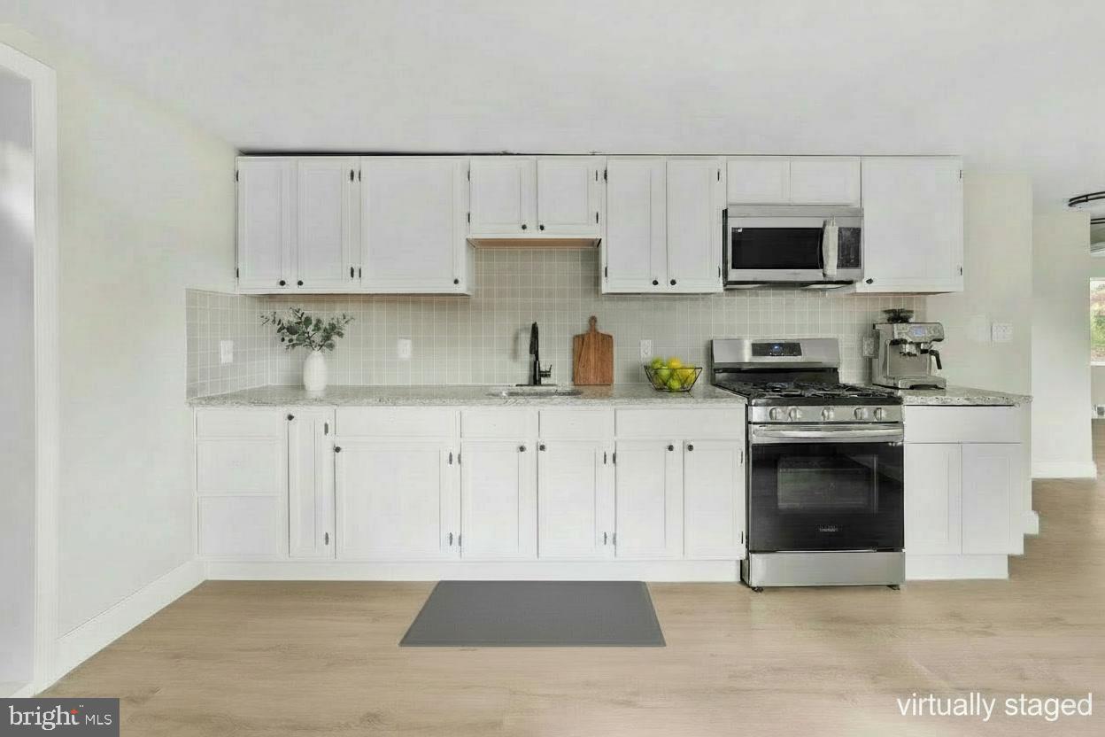 280 Qtn Marlboro Road Salem, NJ 08079 - Photo 20 of 32 a kitchen with stainless steel appliances white cabinets and a sink