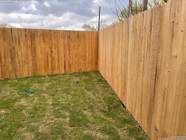 a view of a curtain with a wooden fence
