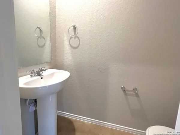 a bathroom with a sink and mirror