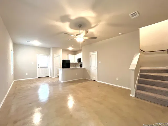 a view of kitchen and hall with wooden floor