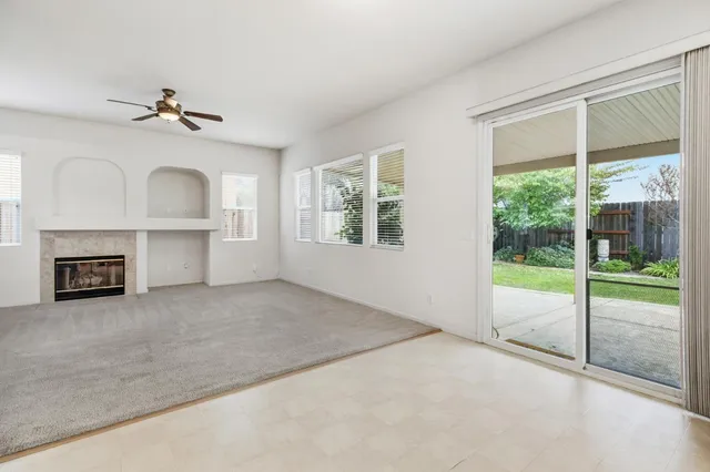a spacious bathroom with a sink and a mirror