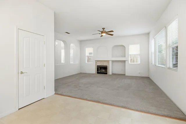 an empty room with a mirror