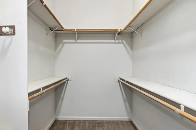 a view of an empty room with windows