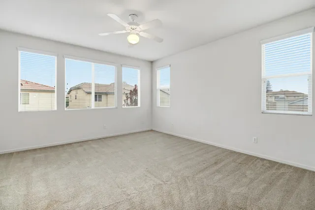 a view of a patio with couches and potted plants