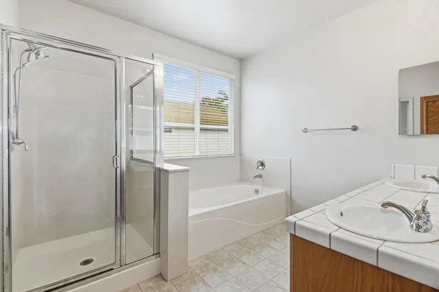 a view of a house with swimming pool and sitting area