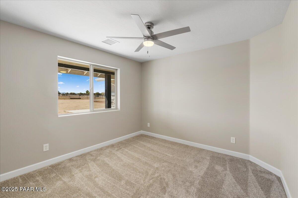1220 East Cougar Ridge Road Paulden, AZ 86334 - Photo 11 of 30 a view of an empty room with a window