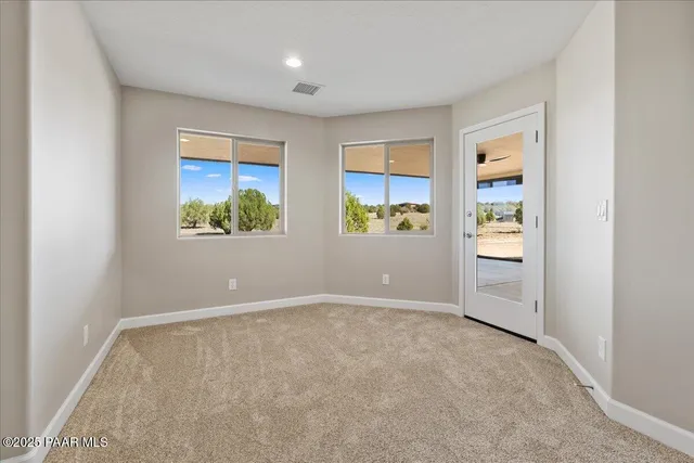 an empty room with windows