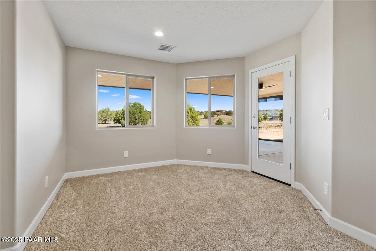 1220 East Cougar Ridge Road Paulden, AZ 86334 - Photo 16 of 30 an empty room with windows