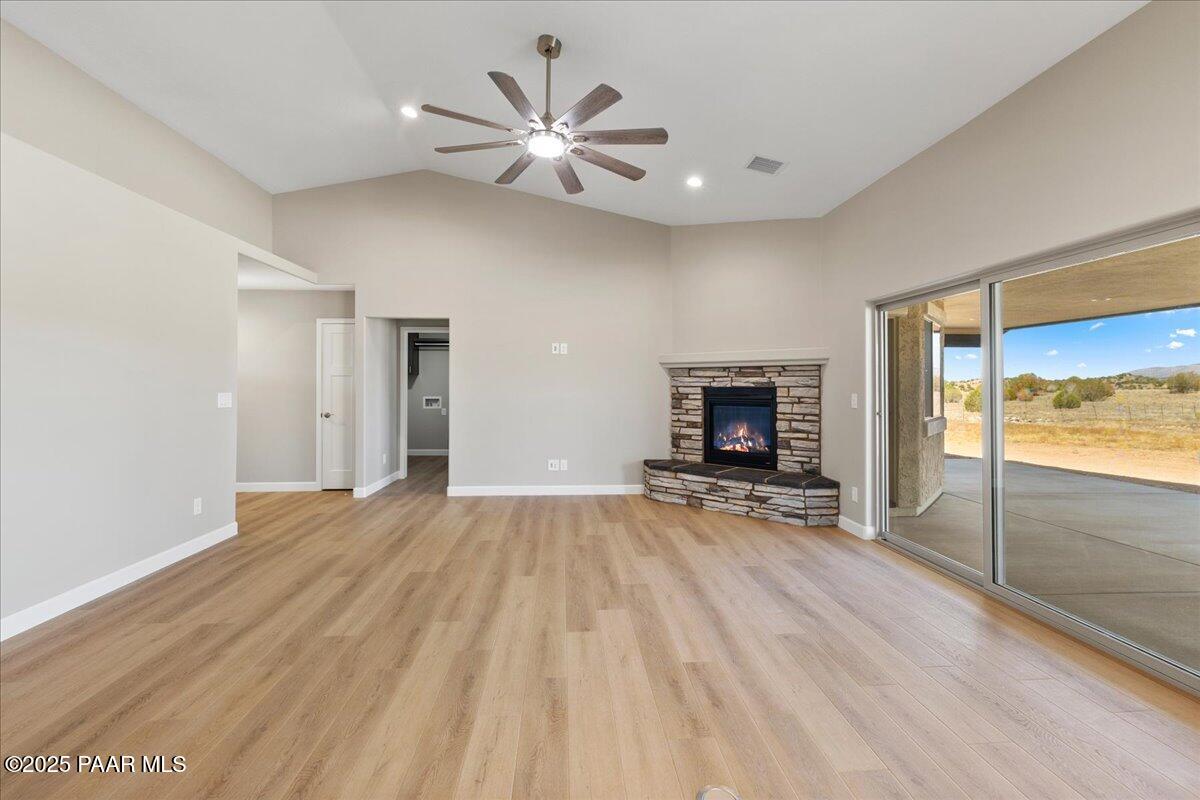 1220 East Cougar Ridge Road Paulden, AZ 86334 - Photo 5 of 30 wooden floor fireplace and natural light in room