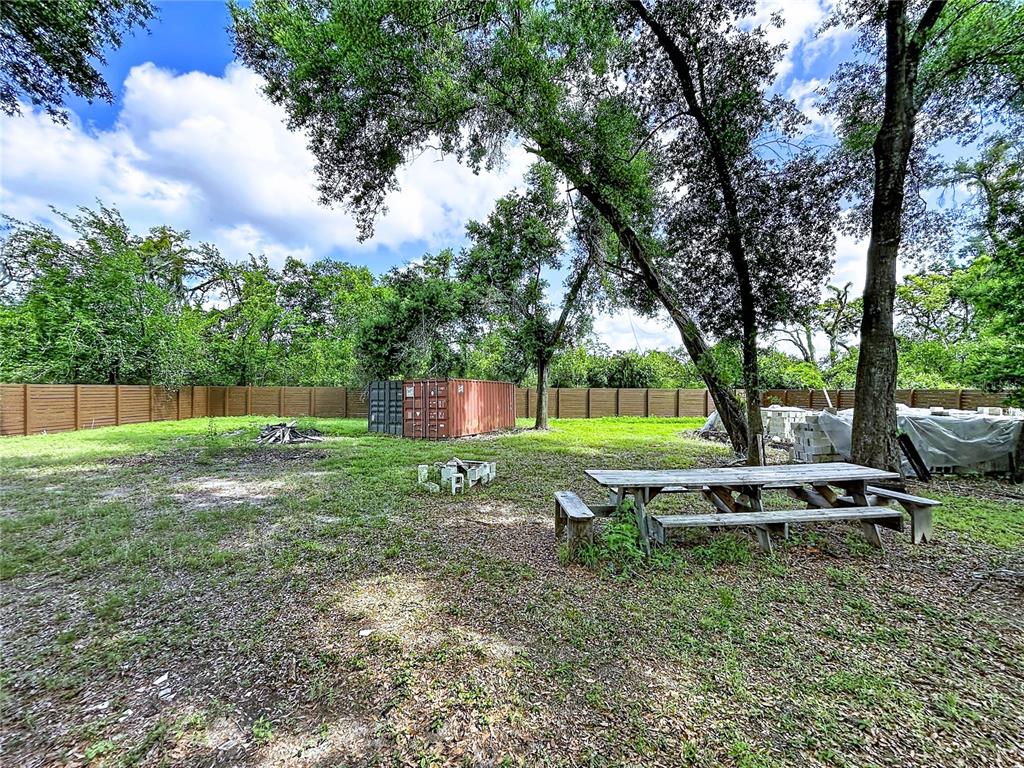 1029 Robson Avenue Seffner, FL 33584 - Photo 4 of 7 a backyard of a house with lots of green space