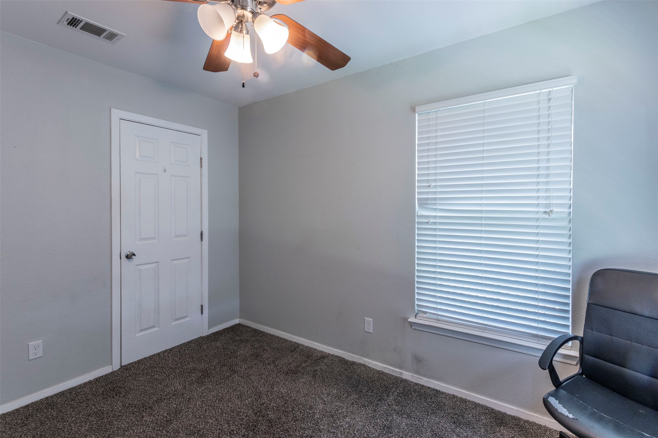 2903 Rogge Lane Austin, TX 78723 - Photo 19 of 26 a view of livingroom with window and ceiling fan
