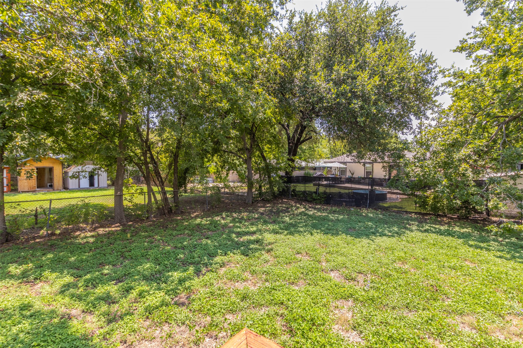 2903 Rogge Lane Austin, TX 78723 - Photo 24 of 26 a view of a yard in front of a house with large trees