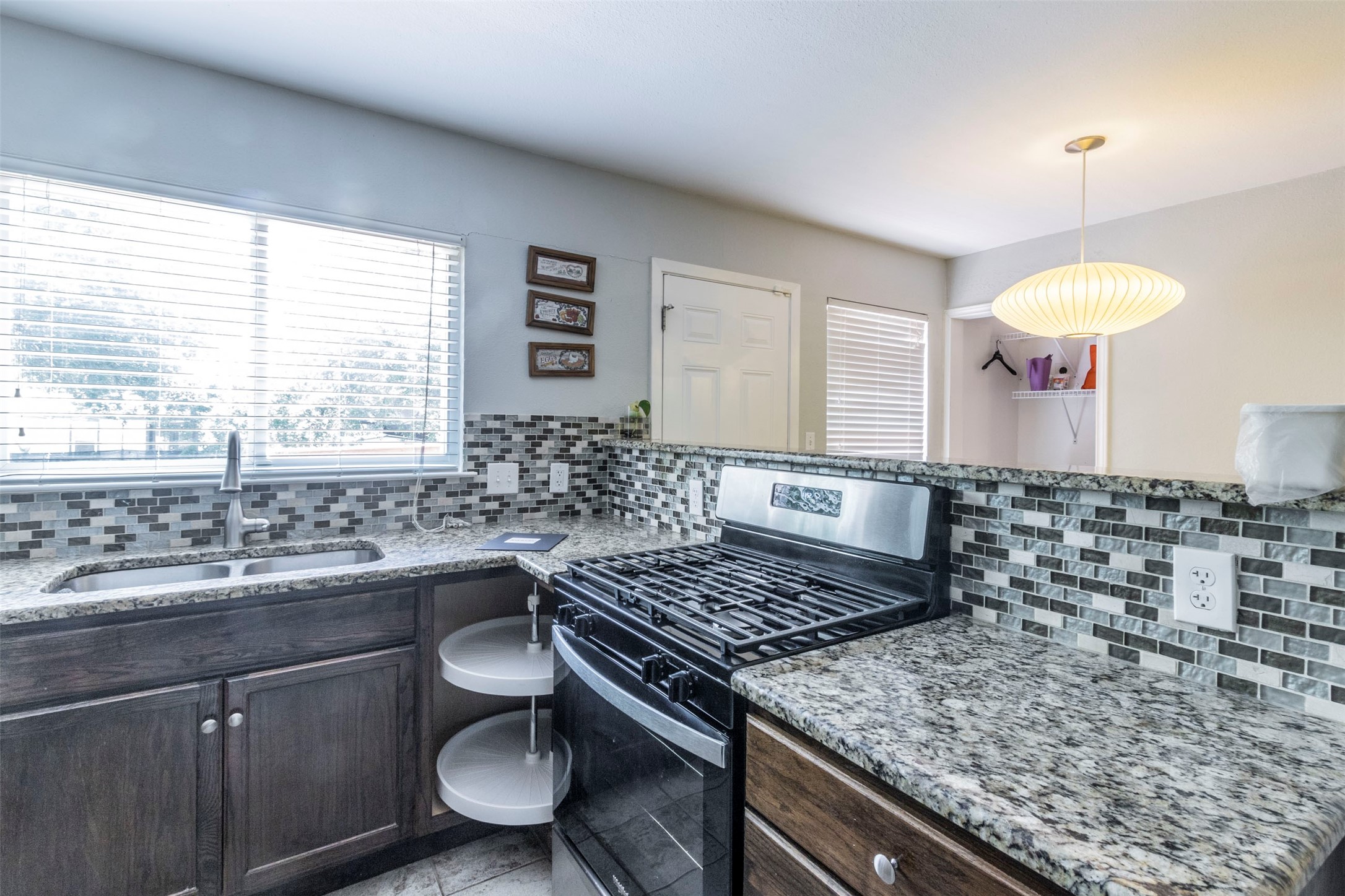 2903 Rogge Lane Austin, TX 78723 - Photo 6 of 26 a kitchen with a sink and stove