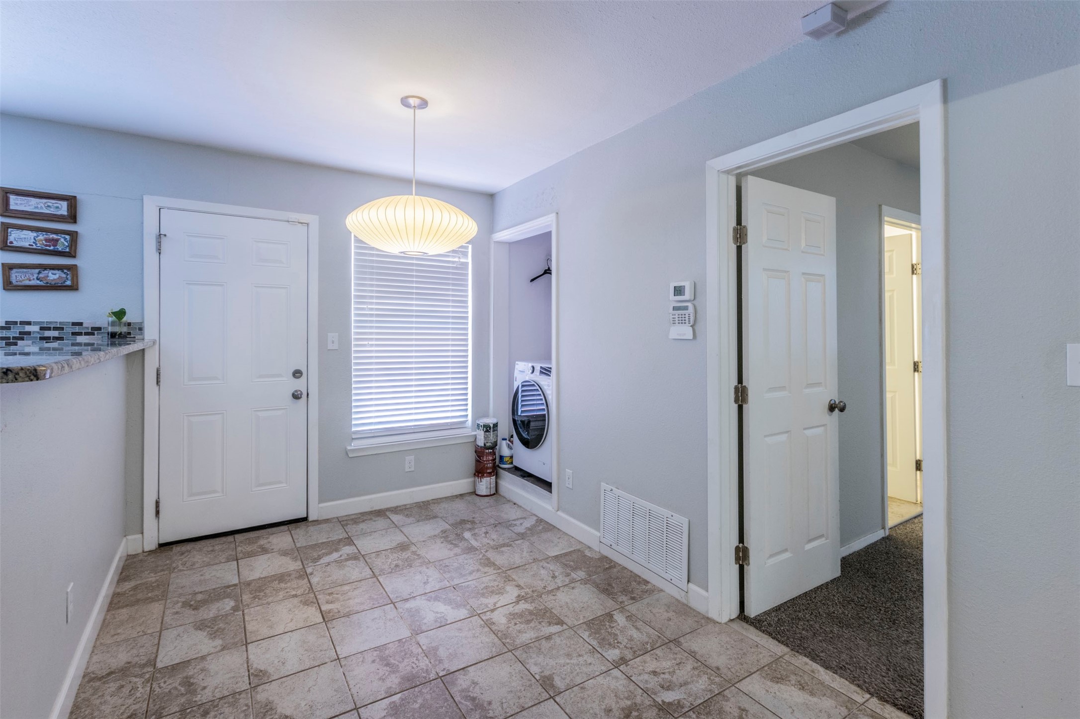 2903 Rogge Lane Austin, TX 78723 - Photo 7 of 26 a bathroom with a sink a light fixture and a mirror