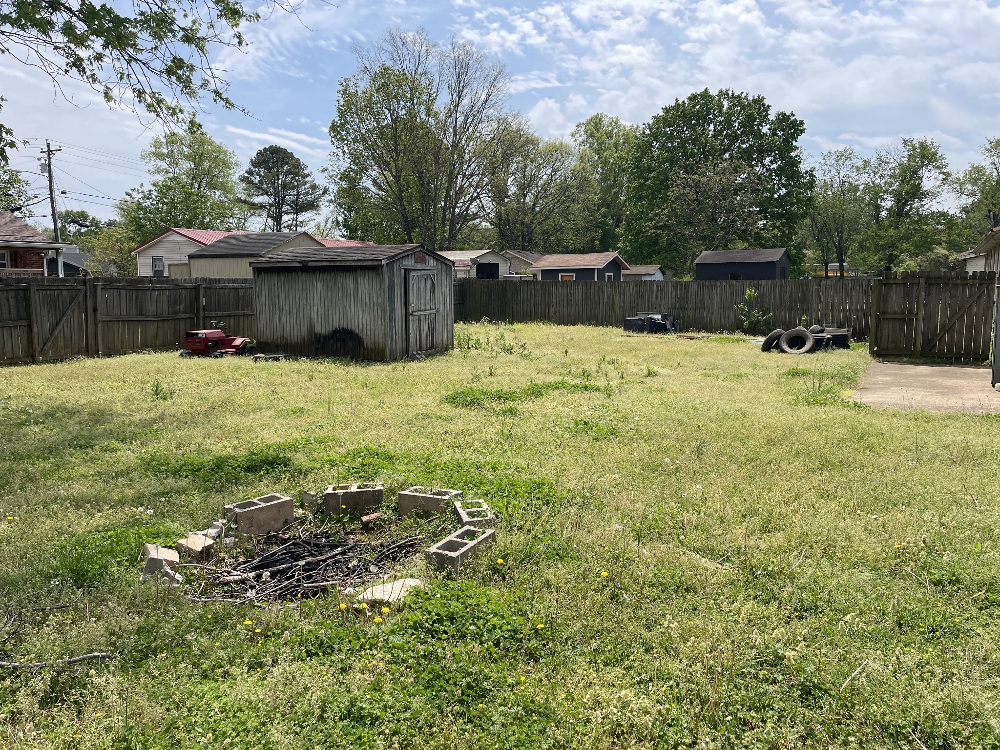 104 Pleasant Drive Smyrna, TN 37167 - Photo 7 of 17 a backyard of a house with a yard and wooden fence