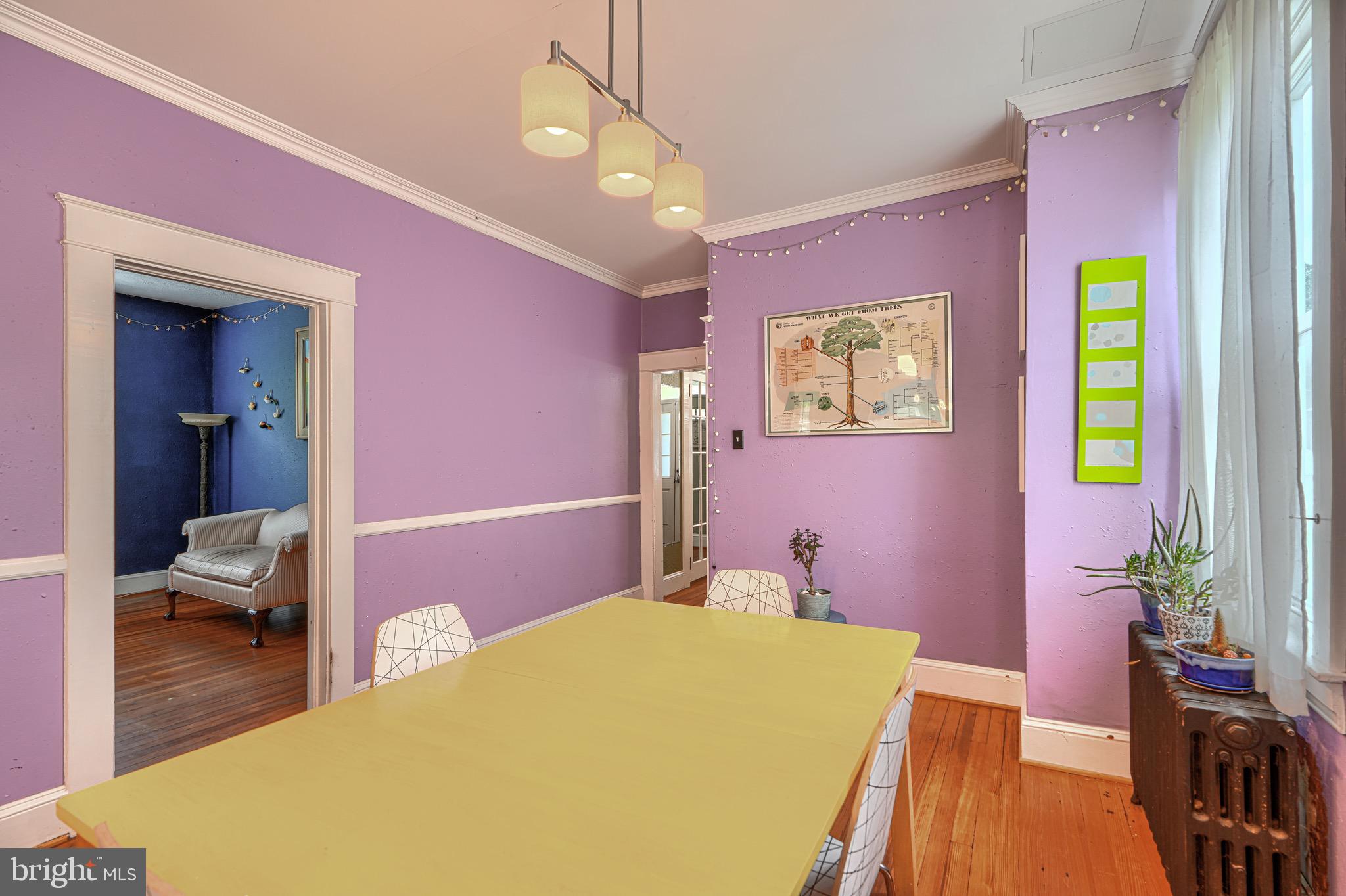 2705 Latona Road Baltimore, MD 21214 - Photo 10 of 53 a bedroom with a bed and a chandelier