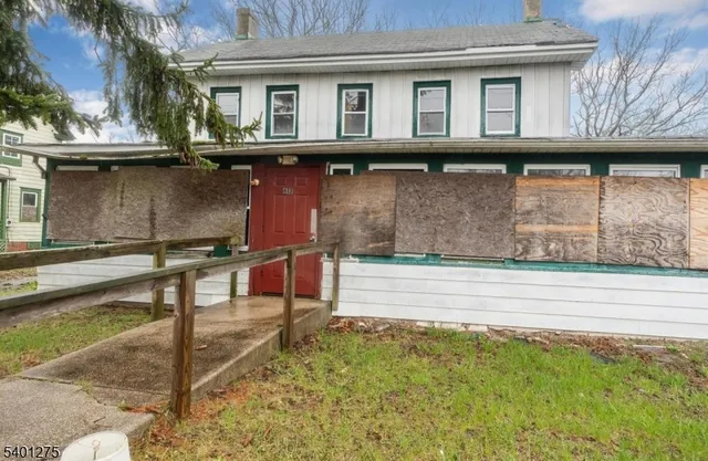 a view of house with outdoor space