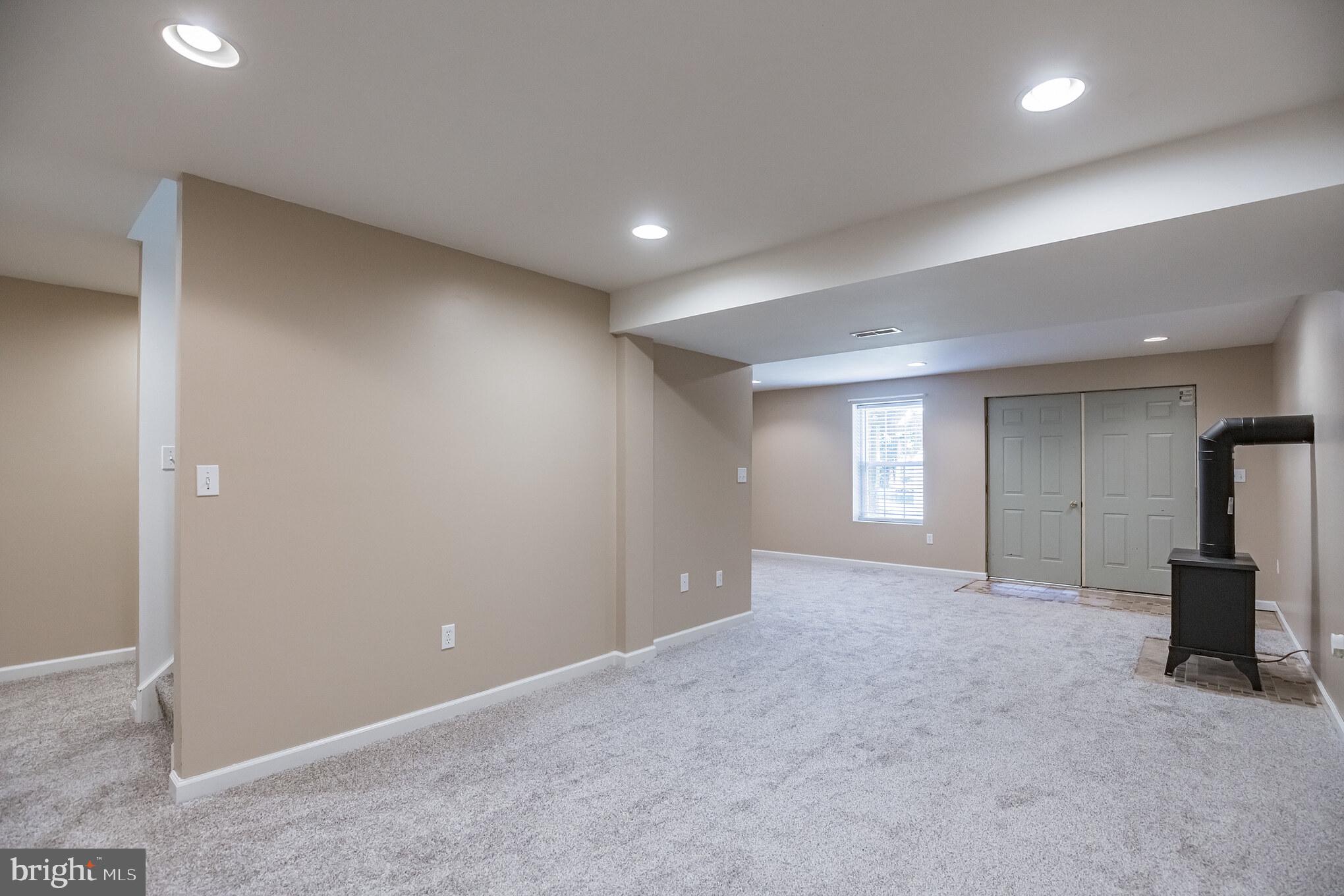 1755 Lottie Fowler Road Prince Frederick, MD 20678 - Photo 23 of 31 Basement Rec Room - double doors to backyard