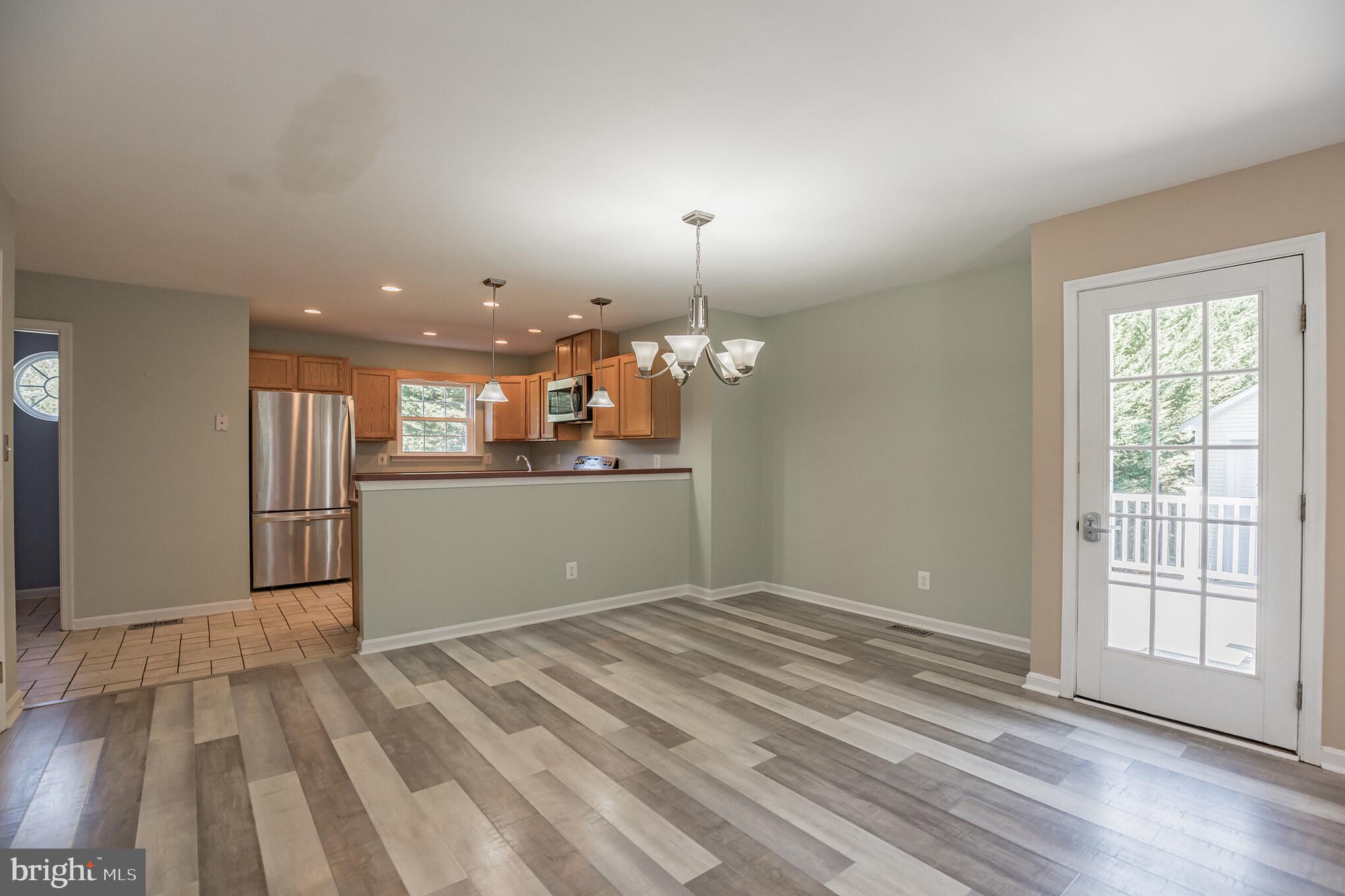 1755 Lottie Fowler Road Prince Frederick, MD 20678 - Photo 7 of 31 Open Dining Room/Kitchen, walkout to deck