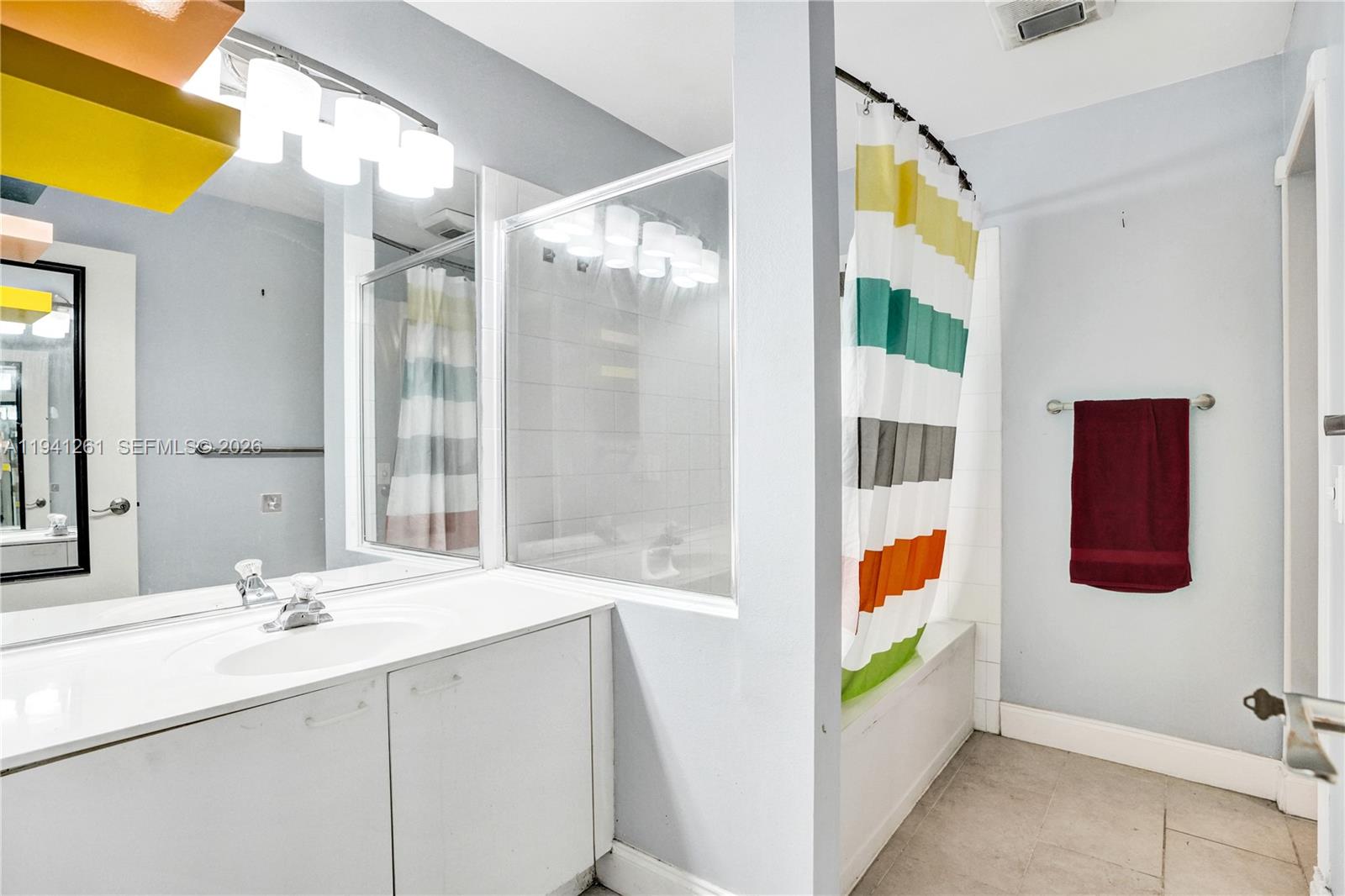 1851 Southwest 116th Way Miramar, FL 33025 - Photo 16 of 30 a bathroom with a sink mirror and vanity