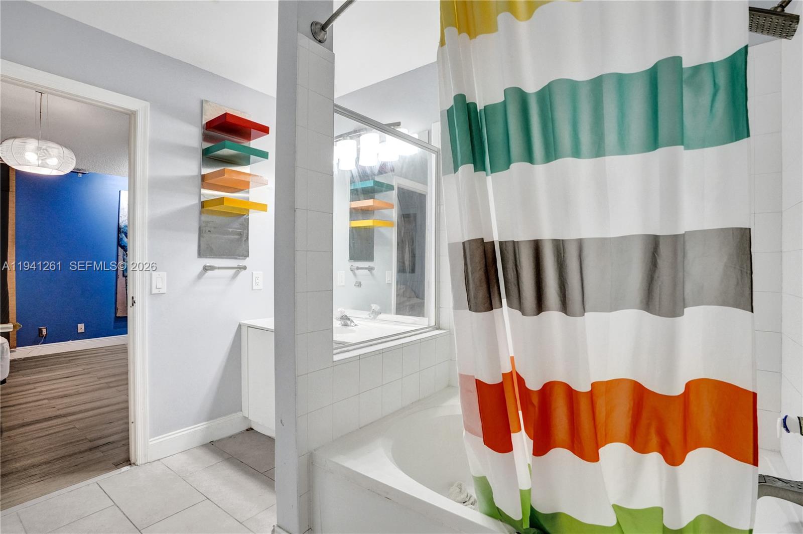 1851 Southwest 116th Way Miramar, FL 33025 - Photo 18 of 30 a bathroom with a bathtub and shower