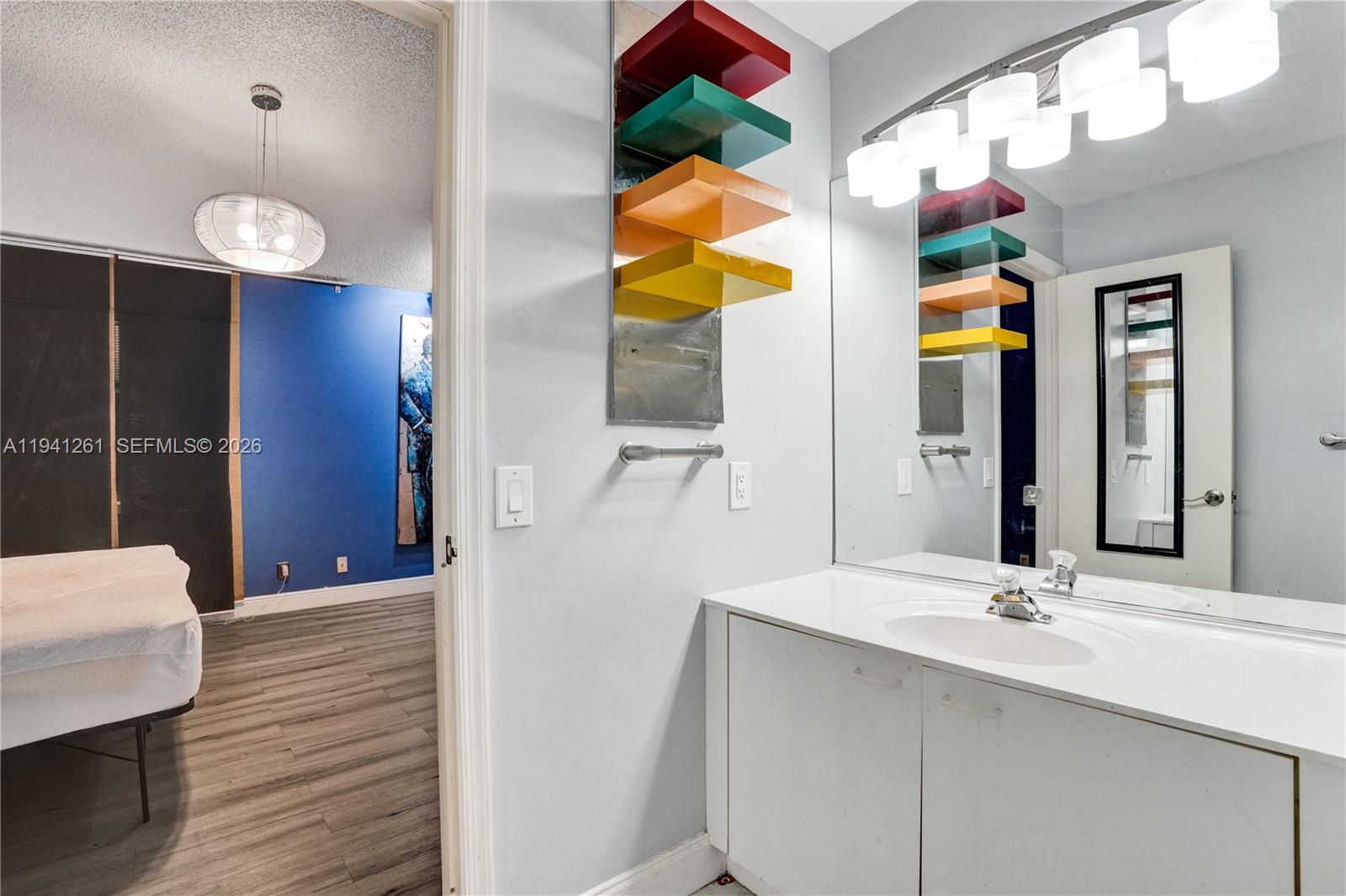 1851 Southwest 116th Way Miramar, FL 33025 - Photo 19 of 30 a bathroom with a sink a vanity and a mirror