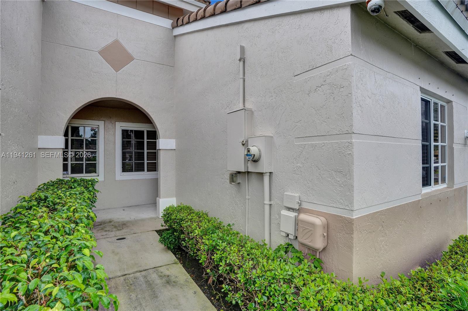1851 Southwest 116th Way Miramar, FL 33025 - Photo 29 of 30 a front view of a house with garden
